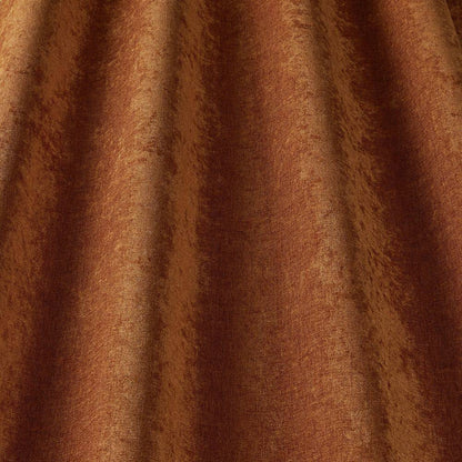 Grosvenor Contract Chenille Rust fabric showcases a rich rust tone with a soft textured finish, ideal for durable upholstery in high-traffic areas.