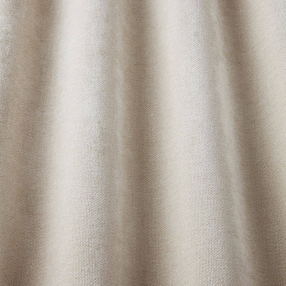 Looma Sustainable Woven Ivory fabric draped to highlight its soft texture and eco-conscious design for curtains and blinds.