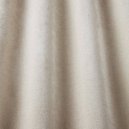 Looma Sustainable Woven Ivory fabric draped to highlight its soft texture and eco-conscious design for curtains and blinds.