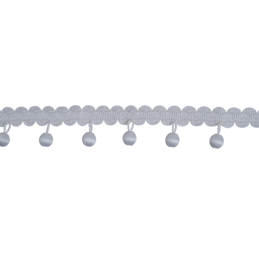 Decorative trim with scalloped edge and small balls on a white background