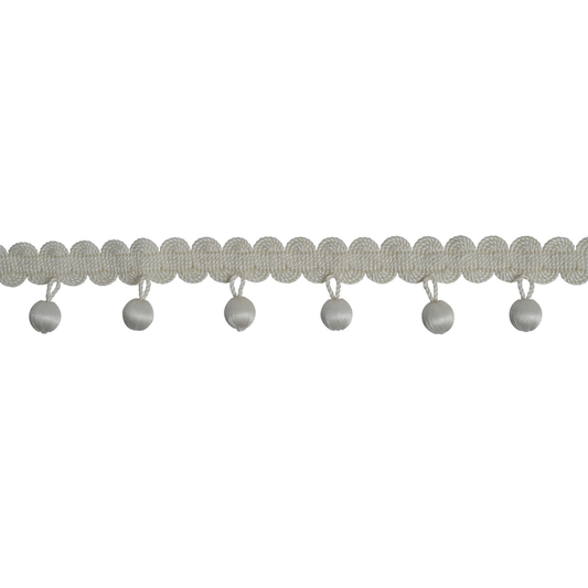 Decorative trim with scalloped edge and small beads on a white background