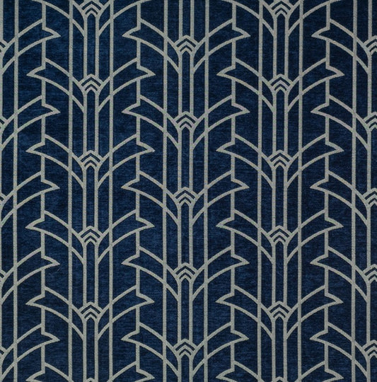 Rhythm Miller Art Deco fabric in luxury chenille with a bold geometric pattern in silver on a deep blue background, ideal for upholstery or décor.