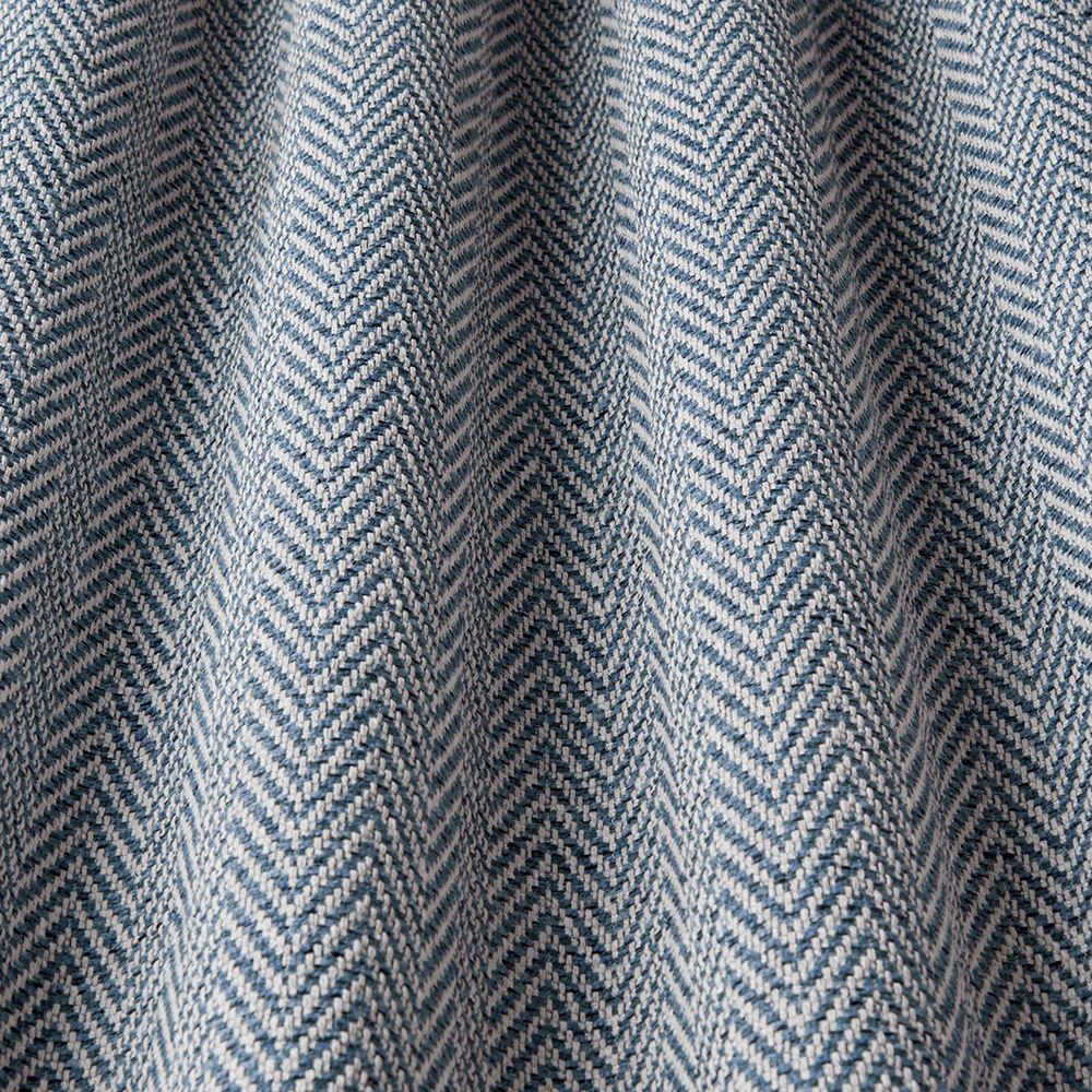 Close-up of a fabric with a blue and white herringbone pattern