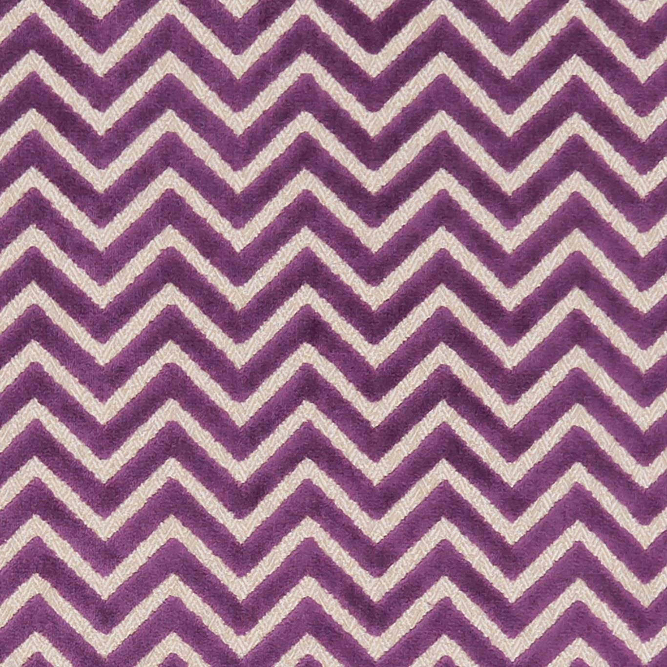 Rafter Chevron Amethyst velvet fabric with bold purple and cream zigzag pattern, ideal for curtains and upholstery in modern interiors.
