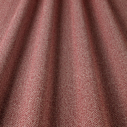 Close-up of a textured fabric with a herringbone pattern in shades of brown.