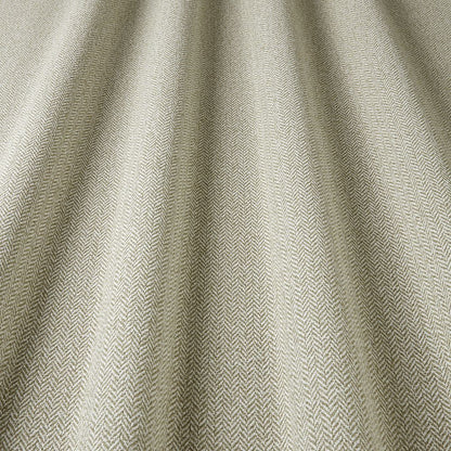Close-up of textured beige fabric with a subtle pattern