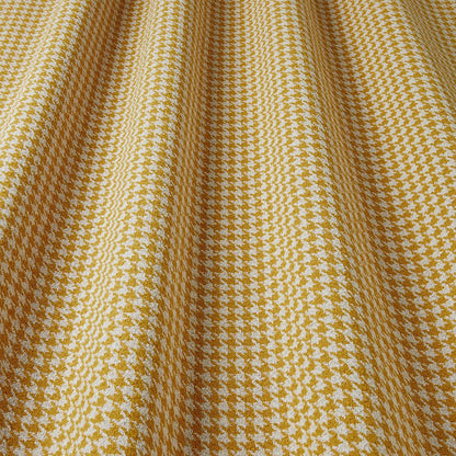 Close-up of yellow and white houndstooth fabric
