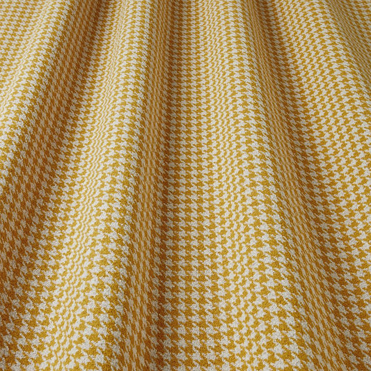 Close-up of yellow and white houndstooth fabric