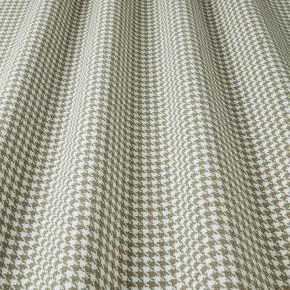 Close-up of houndstooth pattern fabric in olive and white