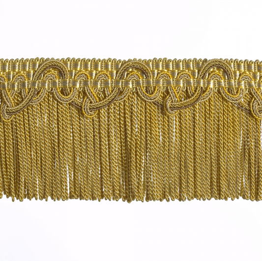 Gold fringe trim on a white background