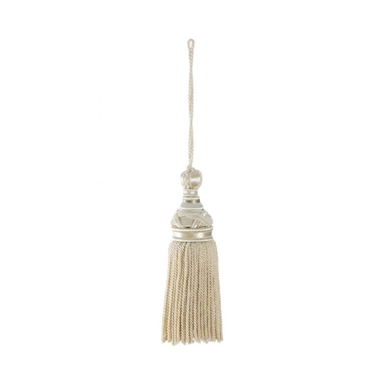 Decorative tassel with a metallic top on a white background
