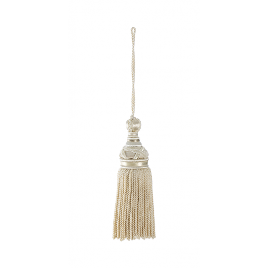 Decorative tassel with a metallic top on a white background