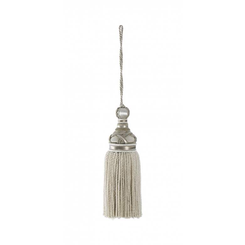 Decorative tassel with metallic top on a white background