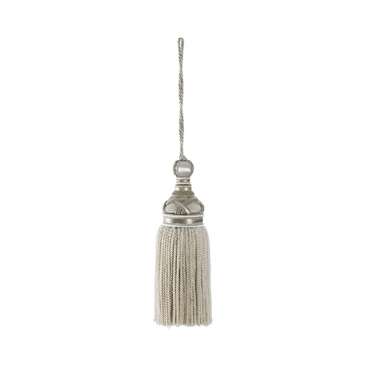 Decorative tassel with metallic top on a white background