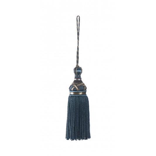 Decorative key tassel with a blue fringe and metallic top on a white background