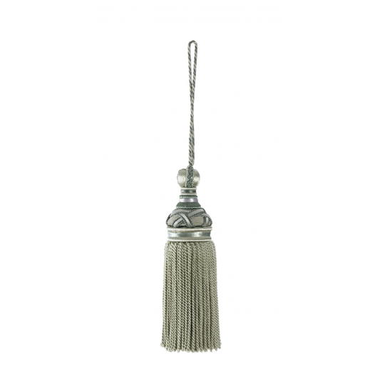 Decorative key tassel with metallic finish on a white background