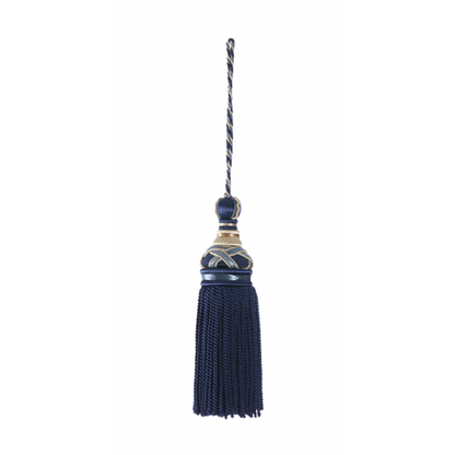 Decorative key tassel with a blue fringe and gold accents on a white background
