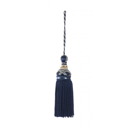 Decorative key tassel with a blue fringe and gold accents on a white background