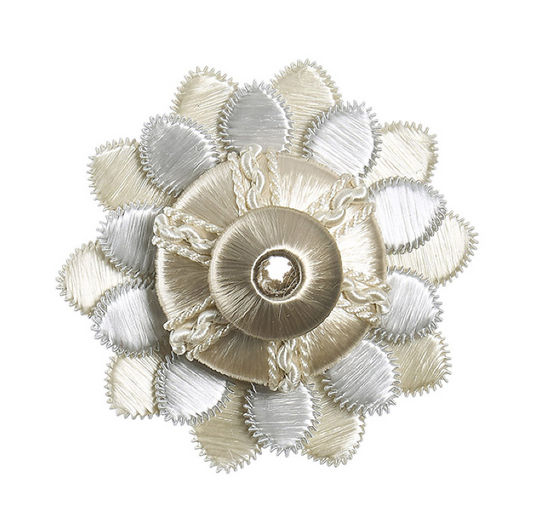 Decorative rosette with gold and silver petals on a white background