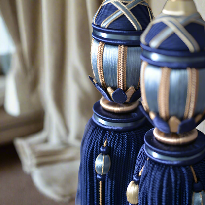 Decorative curtain finials with blue and gold design in a home setting