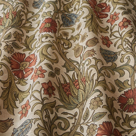 Saint Giles Cayenne fabric with intricate arts and crafts floral patterns in red, blue, and green tones on a beige background, ideal for curtains.