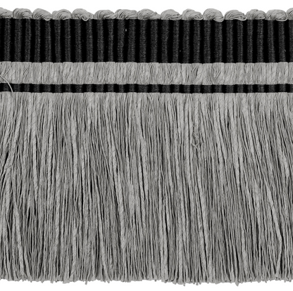 Close-up of a fabric trim with black and gray fringes on a white background