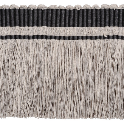 Close-up of a decorative trim with black band and gray fringe on a white background