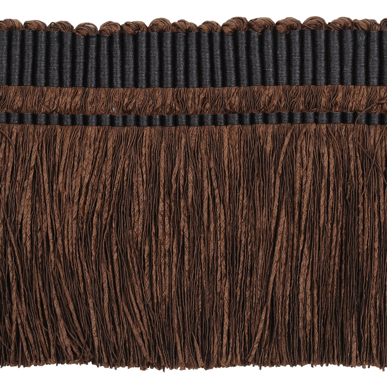 Close-up of brown fringe trim on a white background