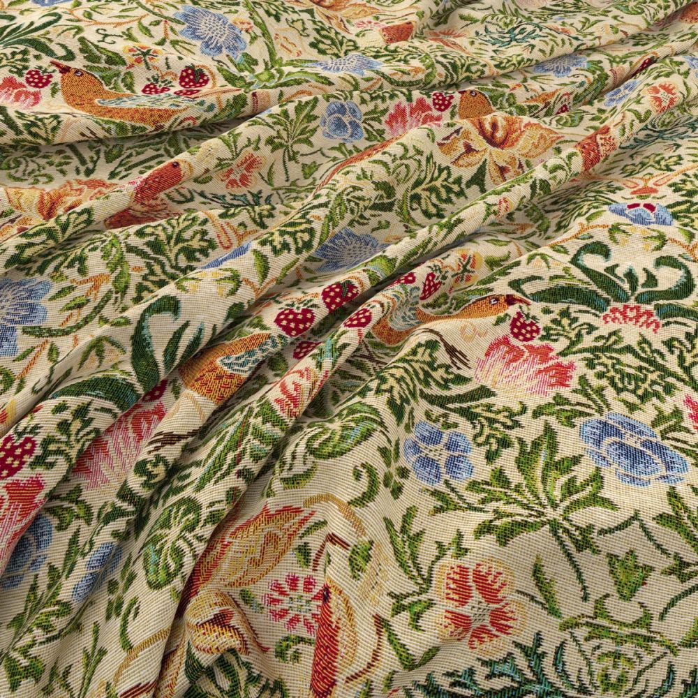 Close-up of William Morris Tapestry Strawberry Thief natural fabric showcasing detailed bird and floral motifs with vibrant colors on a textured surface.