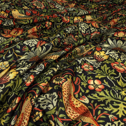 Close-up of William Morris Strawberry Thief Velvet Fabric in Ebony with vibrant floral and bird motifs, perfect for arts and crafts projects.