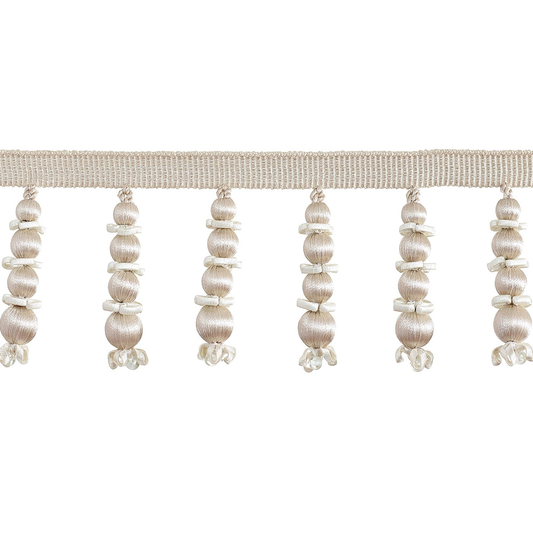 Decorative trim with pearl-like beads on a white background