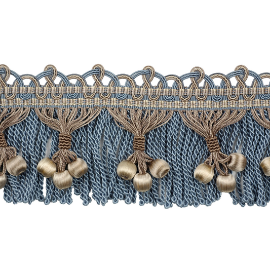 Decorative fabric trim with blue and gold tassels on a white background