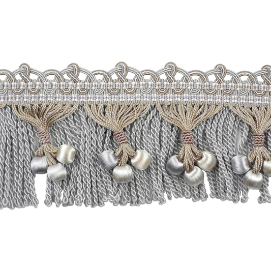 Decorative lace trim with tassels and pearls on a white background