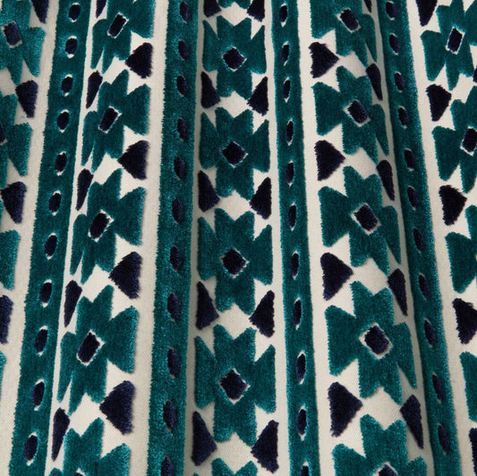 Zanzibar Velvet Ocean fabric with bold geometric patterns in teal and navy, ideal for upholstery and drapery projects.