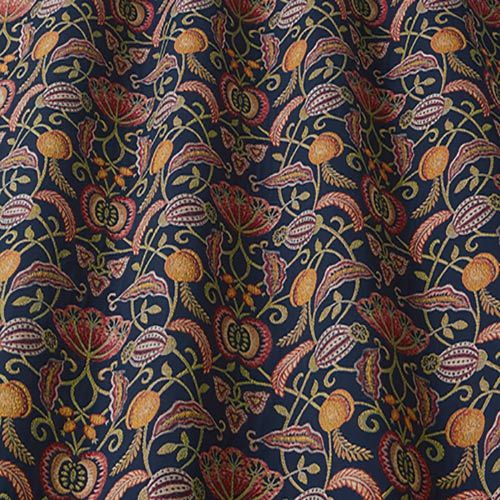 Orchard Indigo fabric featuring a woven leaf and fruit design in vibrant colours on a dark blue background, ideal for arts and crafts projects.